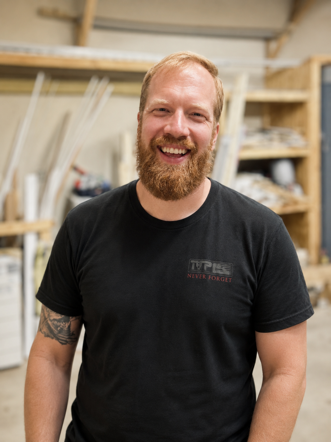 Kendrick, founder of HandyStack, smiling in his workshop