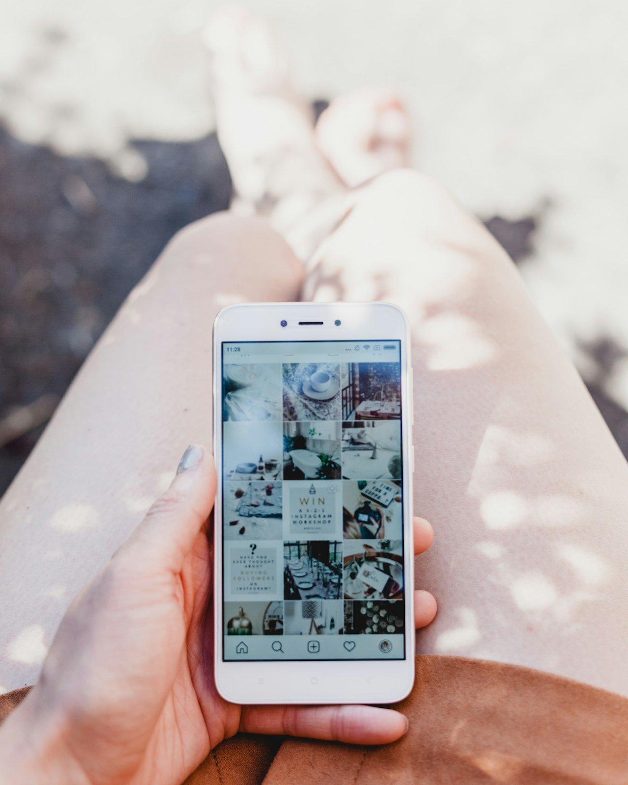 Handyman posting finished work to social media from a phone